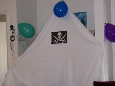 We hung sheets and Jolly Roger flags to make our living room like a pirate ship.